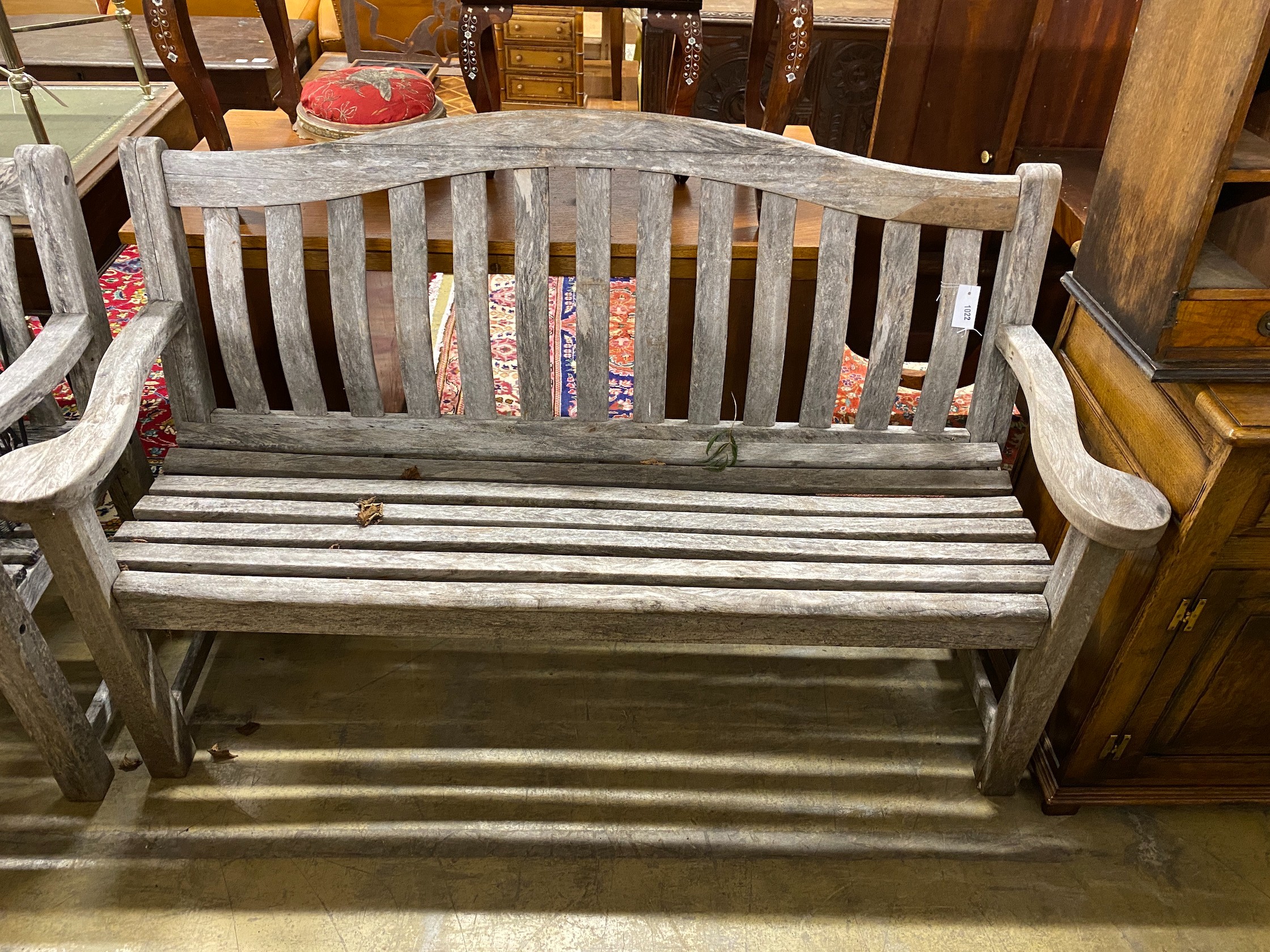 A pair of Alexander Rose weathered teak garden benches, length 155cm, depth 48cm, height 98cm